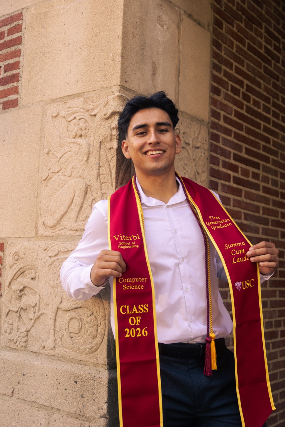 Jayce in a white shirt wearing a USC Viterbi Computer Science graduation stole, Class of 2026